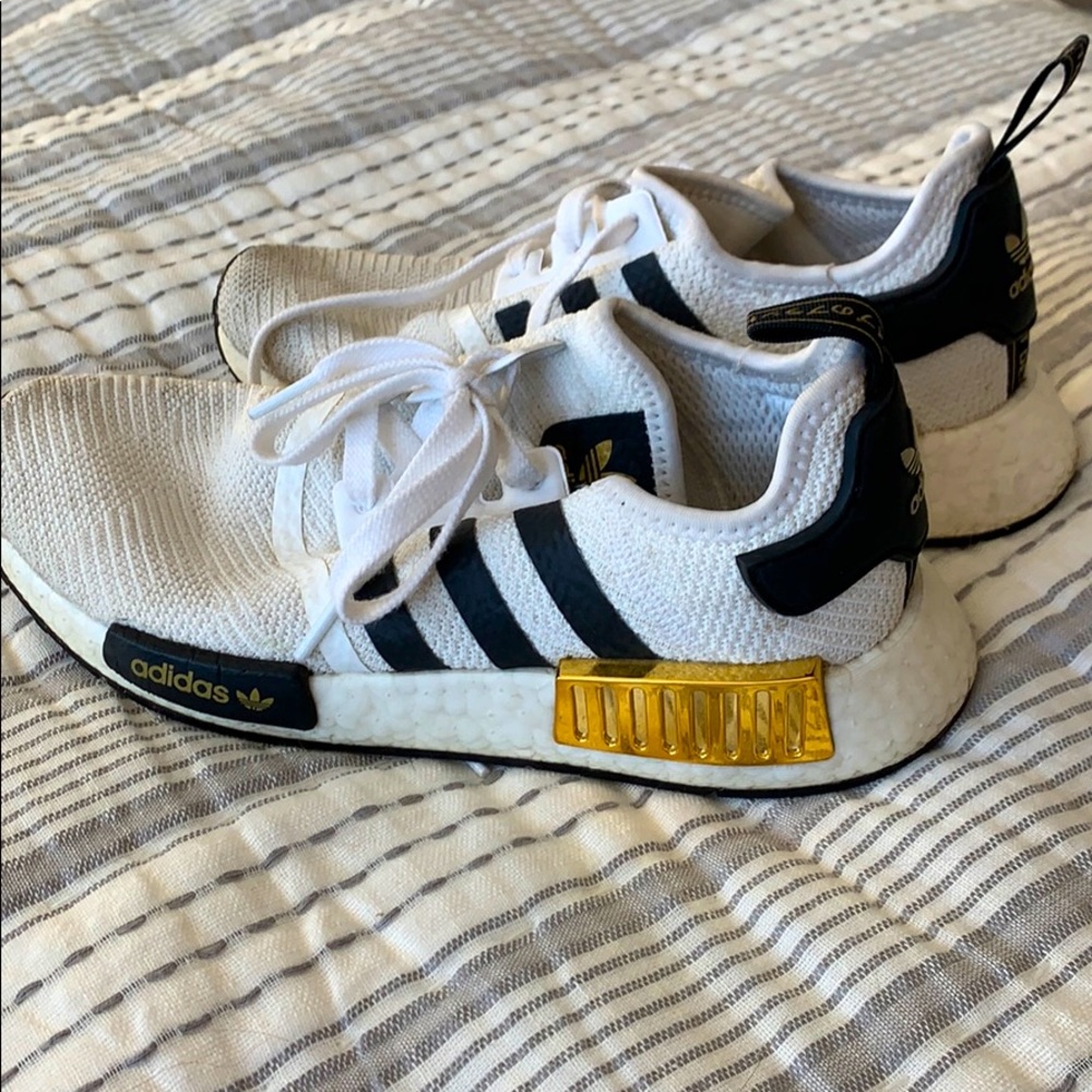 White, black, and gold adidas